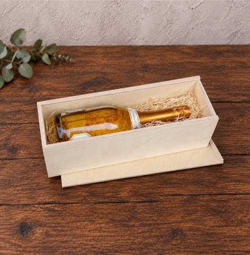 Holzkiste 35 x 10,5 x 10,5 cm mit Sektflasche auf Holzwolle